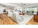 Open living space with hardwood floors, a ceiling fan, and a view of the back patio at 1121 Coast Grade St, Wake Forest, NC 27587