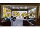 Covered lounge area with comfortable seating, a fireplace, and beautiful views at 1121 Coast Grade St, Wake Forest, NC 27587