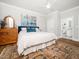 Inviting main bedroom with a ceiling fan, ensuite bathroom, and hardwood floors at 1121 Coast Grade St, Wake Forest, NC 27587