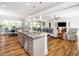 Open floor plan shows kitchen island with dining room and living room in an open concept home at 1121 Coast Grade St, Wake Forest, NC 27587