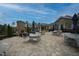 Outdoor patio area with a stone fireplace and comfortable seating arrangements at 1121 Coast Grade St, Wake Forest, NC 27587