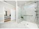 Elegant walk-in shower with glass enclosure, tiled walls, and seating bench at 1121 Coast Grade St, Wake Forest, NC 27587
