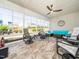Relaxing sunroom with tiled floors, ceiling fan, and lots of natural light at 1121 Coast Grade St, Wake Forest, NC 27587