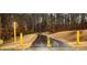 Community walking path surrounded by beautiful trees and landscaping at 1121 Coast Grade St, Wake Forest, NC 27587