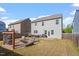 Spacious backyard features a patio, grilling area, outdoor seating and well-maintained lawn at 114 Red Robin Rd, Durham, NC 27703