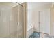 A modern bathroom with a glass shower and separate tub at 114 Red Robin Rd, Durham, NC 27703