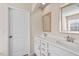 A modern bathroom with double vanity sinks and ample storage at 114 Red Robin Rd, Durham, NC 27703