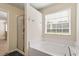 A modern bathroom with a shower and separate soaking tub at 114 Red Robin Rd, Durham, NC 27703