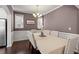 Elegant dining room with seating for six, decorative lighting, and ample natural light at 114 Red Robin Rd, Durham, NC 27703