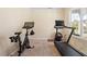 Functional exercise room features a treadmill and exercise bike, perfect for staying active at home at 114 Red Robin Rd, Durham, NC 27703