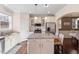 Bright kitchen featuring stainless steel appliances and a granite island at 114 Red Robin Rd, Durham, NC 27703
