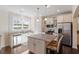 Bright kitchen featuring stainless steel appliances and a granite island at 114 Red Robin Rd, Durham, NC 27703