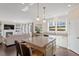 Kitchen with a granite island and an open view into the living room at 114 Red Robin Rd, Durham, NC 27703