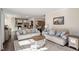 Open-concept living room with a view of the kitchen and dining area, perfect for entertaining at 114 Red Robin Rd, Durham, NC 27703