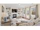 Cozy living room featuring fireplace, built-in shelving, and a comfortable seating arrangement at 114 Red Robin Rd, Durham, NC 27703