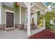 Charming front porch with seating, decorative plants, and a welcoming entrance at 114 Red Robin Rd, Durham, NC 27703