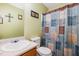 Cozy bathroom with a single sink vanity and a charming patterned shower curtain at 116 Meade Dr, Four Oaks, NC 27524