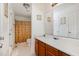Bright bathroom featuring wood vanity, large mirror and patterned shower curtain at 116 Meade Dr, Four Oaks, NC 27524