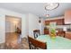 Kitchen includes a table and seating with wood-look flooring and view to the living room at 116 Meade Dr, Four Oaks, NC 27524