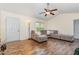 Open living room with vaulted ceiling, wood floors, and neutral color palette at 116 Meade Dr, Four Oaks, NC 27524