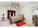 Spacious main bedroom with vaulted ceiling, ceiling fan, and carpet at 116 Meade Dr, Four Oaks, NC 27524