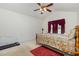 Spacious main bedroom with vaulted ceiling, ceiling fan, and carpet at 116 Meade Dr, Four Oaks, NC 27524