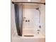 Tub and shower combination featuring a shower curtain and white tile surround at 116 Shawnee Dr, Louisburg, NC 27549