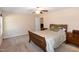 Spacious bedroom featuring neutral walls, carpeted floors, and a cozy bed at 116 Shawnee Dr, Louisburg, NC 27549