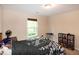 A tidy bedroom featuring a floral bedspread and a window at 116 Shawnee Dr, Louisburg, NC 27549