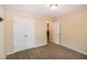 A neutral-toned bedroom featuring a double-door closet at 116 Shawnee Dr, Louisburg, NC 27549