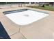 Shallow community pool featuring a clean perimeter; perfect for a refreshing dip when filled at 116 Shawnee Dr, Louisburg, NC 27549