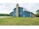 The blue siding and stone chimney highlight this beautiful exterior at 116 Shawnee Dr, Louisburg, NC 27549