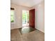 Inviting foyer with wood floors and a view of the front porch through the open doorway at 116 Shawnee Dr, Louisburg, NC 27549