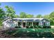Inviting single-story home with a charming front yard and attached garage at 116 Shawnee Dr, Louisburg, NC 27549