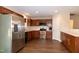 Well-equipped kitchen featuring stainless steel appliances, dark cabinets, and modern fixtures at 116 Shawnee Dr, Louisburg, NC 27549