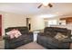 Open-concept living area featuring comfortable seating and a view of the kitchen and dining area at 116 Shawnee Dr, Louisburg, NC 27549