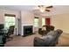 Cozy living room with a fireplace, neutral paint, and comfortable seating at 116 Shawnee Dr, Louisburg, NC 27549