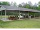 Large community picnic pavilion with multiple picnic tables, ideal for gatherings and outdoor events at 116 Shawnee Dr, Louisburg, NC 27549