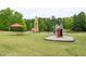 Vibrant community playground with a rocket ship theme and a variety of fun structures for active  at 116 Shawnee Dr, Louisburg, NC 27549