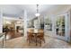 Bright dining area featuring a wooden table set, large window and entry to living room at 1204 Caribou Xing, Durham, NC 27713