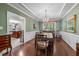 Dining room with tray ceilings, traditional lighting, and access to the kitchen at 1204 Caribou Xing, Durham, NC 27713