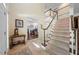 Welcoming foyer with a staircase and views into the office, designed for functionality and style at 1204 Caribou Xing, Durham, NC 27713