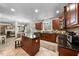 Open kitchen featuring granite countertops, tile floors, and ample cabinet space at 1204 Caribou Xing, Durham, NC 27713
