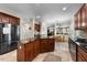 Well-equipped kitchen with stainless steel appliances, center island, and tile flooring at 1204 Caribou Xing, Durham, NC 27713
