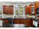 Functional kitchen with dark cabinetry, granite countertops, and stainless steel appliances at 1204 Caribou Xing, Durham, NC 27713