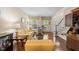 Inviting living room with hardwood floors, staircase, and view of the front door at 1204 Caribou Xing, Durham, NC 27713