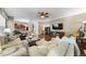 Comfortable living room featuring neutral decor, hardwood floors, and a cozy seating arrangement at 1204 Caribou Xing, Durham, NC 27713
