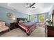 Serene main bedroom featuring a tray ceiling, and ample natural light from multiple windows at 1204 Caribou Xing, Durham, NC 27713