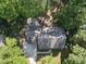 Aerial view of home surrounded by mature trees and foliage at 128 Cobblestone Dr, Chapel Hill, NC 27516