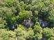 Aerial view of multiple homes nestled in a lush forest at 128 Cobblestone Dr, Chapel Hill, NC 27516